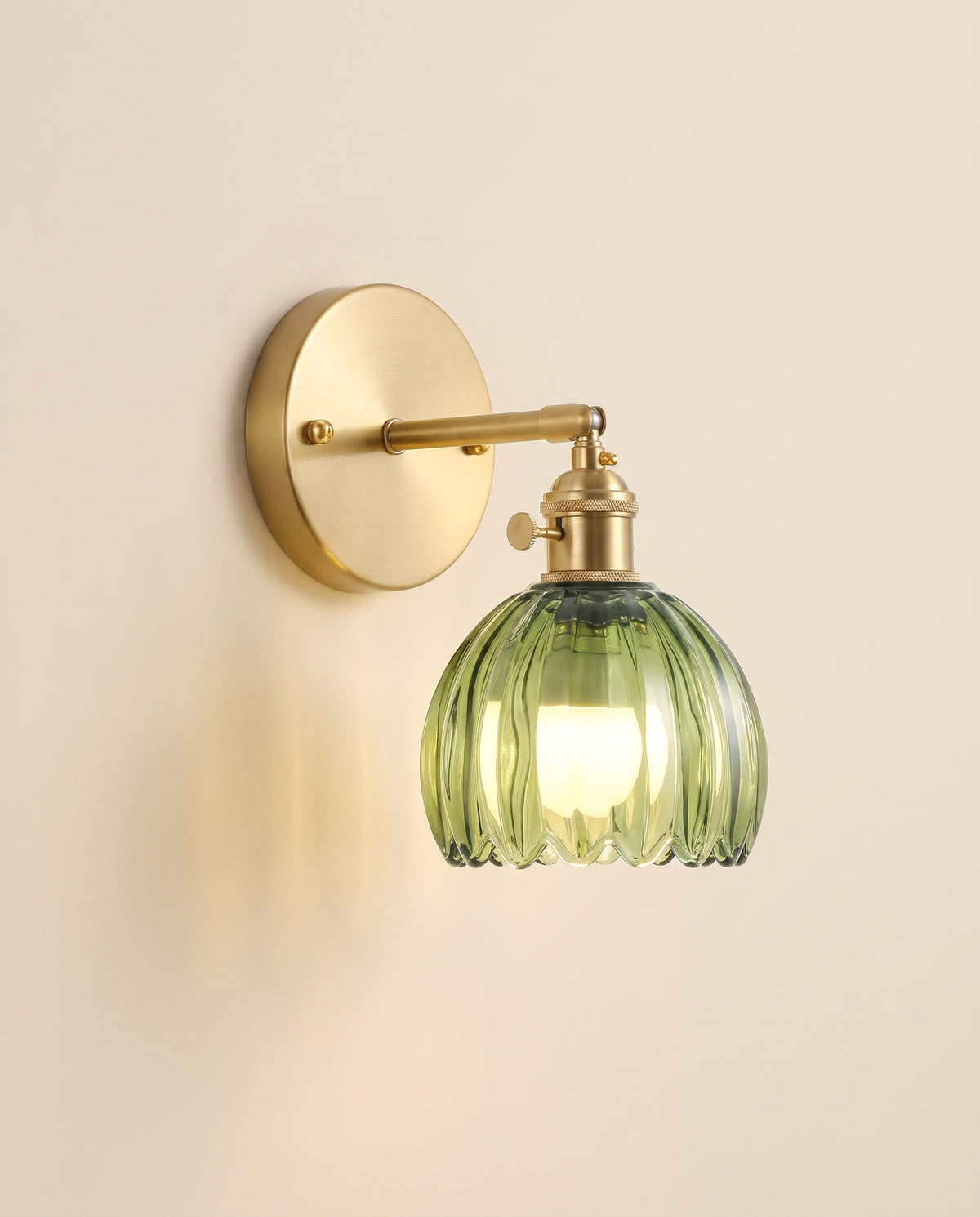 Rechargeable wall sconce with brass plate and ribbed green glass shade
